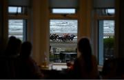 8 September 2022; A general view of runners and riders during the Gilna´s Cottage Inn race watched by customers inside Relish Cafe at the Laytown Strand Races in Laytown, Co Meath. Photo by David Fitzgerald/Sportsfile