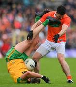 12 June 2022; Michael Murphy of Donegal tussles with Aidan Forker of Armagh during the GAA Football All-Ireland Senior Championship Round 2 match between between Donegal and Armagh at St Tiernach's Park in Clones, Monaghan. Photo by Seb Daly/Sportsfile