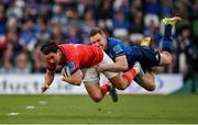 21 May 2022; Joey Carbery of Munster is tackled by Rory O'Loughlin of Leinster during the United Rugby Championship match between Leinster and Munster at Aviva Stadium in Dublin. Photo by Brendan Moran/Sportsfile