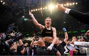 30 April 2022; Katie Taylor and coach Ross Enamait, left, celebrate victory after her undisputed world lightweight championship fight with Amanda Serrano at Madison Square Garden in New York, USA. Photo by Stephen McCarthy/Sportsfile