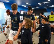 10 December 2022; Josh van der Flier and James Lowe of Leinster walk out with mascots before the Heineken Champions Cup Pool A Round 1 match between Racing 92 and Leinster at Stade Océane in Le Havre, France. Photo by Harry Murphy/Sportsfile