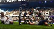 10 December 2022; Dan Sheehan of Leinster scores his side's second try despite the tackle of Finn Russell of Racing 92 during the Heineken Champions Cup Pool A Round 1 match between Racing 92 and Leinster at Stade Océane in Le Havre, France. Photo by Harry Murphy/Sportsfile