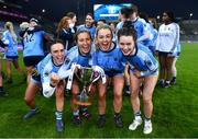 10 December 2022; Longford Slashers players, from left, Clare Farrell, Emily Reilly, Laura Kenny and Grace Kenny celebrate with the cup after the 2022 currentaccount.ie LGFA All-Ireland Intermediate Club Football Championship Final match between Longford Slashers of Longford and Mullinahone of Tipperary at Croke Park in Dublin. Photo by Ben McShane/Sportsfile