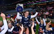 10 December 2022; Eva Noone of Kilkerrin-Clonberne celebrates with the cup and her teammates after the 2022 currentaccount.ie LGFA All-Ireland Senior Club Football Championship Final match between Donaghmoyne of Monaghan, and Kilkerrin-Clonberne of Galway at Croke Park in Dublin. Photo by Ben McShane/Sportsfile