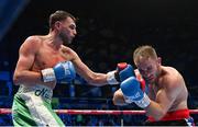 10 December 2022; Sean McComb, left, and Zsolt Osadan during their WBO European Super-Lightweight title bout at the SSE Arena in Belfast. Photo by Ramsey Cardy/Sportsfile
