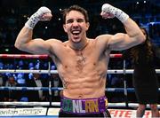 10 December 2022; Michael Conlan celebrates defeating Karim Guerfi in their featherweight bout at the SSE Arena in Belfast. Photo by Ramsey Cardy/Sportsfile