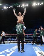 10 December 2022; Michael Conlan celebrates defeating Karim Guerfi in their featherweight bout at the SSE Arena in Belfast. Photo by Ramsey Cardy/Sportsfile