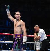 10 December 2022; Michael Conlan celebrates defeating Karim Guerfi in the first round of their featherweight bout at the SSE Arena in Belfast. Photo by Ramsey Cardy/Sportsfile