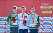 11 December 2022; U20 men's medalist from left, silver medallist, Nicholas Griggs of Ireland, gold medallist, Will Barnicoat of Great Britain and Dean Casey of Ireland, collect their medals in the U20 men's 6000m during the SPAR European Cross Country Championships at Piemonte-La Mandria Park in Turin, Italy. Photo by Sam Barnes/Sportsfile