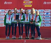 11 December 2022; The Ireland women's senior team from left, Michelle Finn, Eilish Flanagan of Ireland, Roisin Flanagan, Aoibhe Richardson, Mary Mulhare and Ann-Marie McGlynn, stand on the podium with their medals after competing in the senior women's 8000m during the SPAR European Cross Country Championships at Piemonte-La Mandria Park in Turin, Italy. Photo by Sam Barnes/Sportsfile