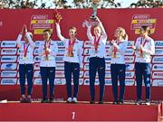 11 December 2022; The British U23 women's team celebrate with their medals after competing in the U23 Women's 6500m during the SPAR European Cross Country Championships at Piemonte-La Mandria Park in Turin, Italy. Photo by Sam Barnes/Sportsfile