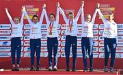 11 December 2022; The British U23 women's team celebrate with their medals after competing in the U23 Women's 6500m during the SPAR European Cross Country Championships at Piemonte-La Mandria Park in Turin, Italy. Photo by Sam Barnes/Sportsfile