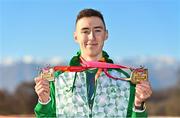 11 December 2022; Dean Casey of Ireland, with his U20 men's team silver medal, and individual bronze medal after competing in the U20 men's 6000m during the SPAR European Cross Country Championships at Piemonte-La Mandria Park in Turin, Italy. Photo by Sam Barnes/Sportsfile