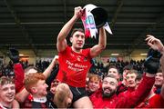 11 December 2022; Fossa captain Paudie Clifford lifts the cup after his side's victory in the AIB Munster GAA Football Junior Club Championship Final match between Fossa and Kilmurry at Mallow GAA Sports Complex in Cork. Photo by Michael P Ryan/Sportsfile