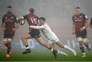 11 December 2022; Mike Haley of Munster is tackled by Antoine Dupont of Toulouse during the Heineken Champions Cup Pool B Round 1 match between Munster and Toulouse at Thomond Park in Limerick. Photo by Harry Murphy/Sportsfile