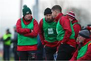 11 December 2022; Fossa manager Adrian Sheehan, left, speaks with his coaching staff including Eamonn Fitzmaurice during the AIB Munster GAA Football Junior Club Championship Final match between Fossa and Kilmurry at Mallow GAA Sports Complex in Cork. Photo by Michael P Ryan/Sportsfile