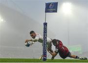 11 December 2022; Matthis Lebel of Toulouse on his way to scoring his side's first try despite the tackle of Shane Daly of Munster during the Heineken Champions Cup Pool B Round 1 match between Munster and Toulouse at Thomond Park in Limerick. Photo by Harry Murphy/Sportsfile