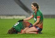 10 December 2022; Eimear Horan of Mullinahone, right, consoles her team-mate Molly Walsh, following their side's defeat in the 2022 currentaccount.ie LGFA All-Ireland Intermediate Club Football Championship Final match between Longford Slashers of Longford and Mullinahone of Tipperary at Croke Park in Dublin. Photo by Tyler Miller/Sportsfile