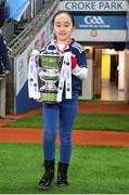 10 December 2022; Kilkerrin-Clonberne mascot Zara Glynn, walks to place the trophy onto the stand before the 2022 currentaccount.ie LGFA All-Ireland Senior Club Football Championship Final match between Donaghmoyne of Monaghan, and Kilkerrin-Clonberne of Galway at Croke Park in Dublin. Photo by Tyler Miller/Sportsfile
