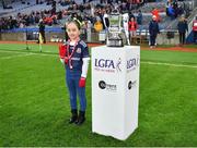 10 December 2022; Kilkerrin-Clonberne mascot Zara Glynn, places the trophy onto the stand before the 2022 currentaccount.ie LGFA All-Ireland Senior Club Football Championship Final match between Donaghmoyne of Monaghan, and Kilkerrin-Clonberne of Galway at Croke Park in Dublin. Photo by Tyler Miller/Sportsfile