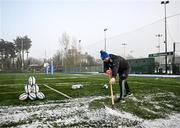 12 December 2022; Senior kitman Jim Bastick clears snow during a Leinster Rugby squad training session at Energia Park in Dublin. Photo by Harry Murphy/Sportsfile