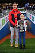 10 December 2022; Kilkerrin-Clonberne mascot Zara Glynn and her father Jason Glynn hold the trophy before the 2022 currentaccount.ie LGFA All-Ireland Senior Club Football Championship Final match between Donaghmoyne of Monaghan, and Kilkerrin-Clonberne of Galway at Croke Park in Dublin. Photo by Tyler Miller/Sportsfile
