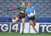 10 December 2022; Clare Farrell of Longford Slashers and Chloe Gunn of Mullinahone during the 2022 currentaccount.ie LGFA All-Ireland Intermediate Club Football Championship Final match between Longford Slashers of Longford and Mullinahone of Tipperary at Croke Park in Dublin. Photo by Ben McShane/Sportsfile