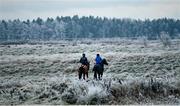 13 December 2022; Horses and riders on the gallops at the Curragh, Co Kildare. Photo by David Fitzgerald/Sportsfile