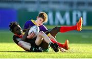 15 December 2022; Sean Gibbons of Ardgillian is tackled by Johnson Junior Lionde of St Mary's during the Bank of Ireland Leinster Rugby Pat Rossiter Cup (JCT) match between St. Mary's CBS, Portlaoise and Ardgillan Community College at Energia Park in Dublin. Photo by Ben McShane/Sportsfile