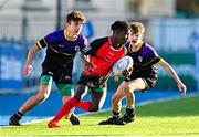 15 December 2022; Johnson Junior Lionde of St Mary's evades the tackles of Darragh Cullen, left, and Sean Gibbons of Ardgillian during the Bank of Ireland Leinster Rugby Pat Rossiter Cup (JCT) match between St. Mary's CBS, Portlaoise and Ardgillan Community College at Energia Park in Dublin. Photo by Ben McShane/Sportsfile
