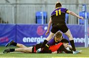 15 December 2022; Theo Adams of St Mary's scores a try despite the tackle of Darragh Cullen, bottom, and Conor O'Grady of Ardgillian during the Bank of Ireland Leinster Rugby Pat Rossiter Cup (JCT) match between St. Mary's CBS, Portlaoise and Ardgillan Community College at Energia Park in Dublin. Photo by Ben McShane/Sportsfile
