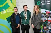 15 December 2022; In attendance is Ronan Grimes, centre, with Paralympics Ireland vice-president Dennis Toomey and Cycling Ireland vice-president Louise Reilly as the Irish para-cycling squad met at the Sport Ireland Institute today and were presented with medals won at the Para-cycling Road World Championships in Canada in August. Athletes Ronan Grimes, Katie-George Dunlevy, Eve McCrystal, Josephine Healion and Linda Kelly (absent due to illness) were presented with their medals by Cycling Ireland vice-president Louise Reilly and Paralympics Ireland vice-president Dennis Toomey. Also present was Sport Ireland CEO Una May Cycling, Sport Ireland Institute Director Liam Harbison, Ireland head coach Neill Delahaye and newly appointed national paracycling coach Jamie Blanchfield. Photo by David Fitzgerald/Sportsfile