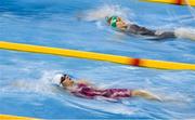 16 December 2022; Naroa Sanz of Longford SC, bottom, and Antonina Sech of Sundays Well SC compete in the heats of the Women's 100m backstroke during day two of the Irish National Winter Swimming Championships 2022 at the National Aquatic Centre, on the Sport Ireland Campus, in Dublin. Photo by David Fitzgerald/Sportsfile