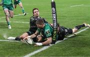 16 December 2022; Diarmuid Kilgallen of Connacht scores his side's third try despite the attempts of Nicolas Sanchez of CA Brive during the EPCR Challenge Cup Pool A Round 2 match between CA Brive and Connacht at the Stade Amédée-Doménech in Brive, France. Photo by Manuel Blondeau/Sportsfile