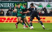 16 December 2022; Adam Byrne of Connacht evades the tackle of Tietie Tuimauga of Brive during the EPCR Challenge Cup Pool A Round 2 match between CA Brive and Connacht at the Stade Amédée-Doménech in Brive, France. Photo by Manuel Blondeau/Sportsfile