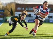 17 December 2022; Maeve Liston of Blackrock College evades the tackle of Railway Union's Molly Scuffil McCabe on her way to scoring her side's first try during the Energia AIL Women's Division Final match between Blackrock College and Railway Union at Energia Park in Dublin. Photo by Seb Daly/Sportsfile