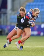 17 December 2022; Anna Doyle of Blackrock College is tackled by Aoife O’Shaughnessy of Railway Union during the Energia AIL Women's Division Final match between Blackrock College and Railway Union at Energia Park in Dublin. Photo by Seb Daly/Sportsfile