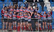 17 December 2022; Blackrock College captain Michelle Claffey lift the cup alongside teammates after their side's victory in the Energia AIL Women's Division Final match between Blackrock College and Railway Union at Energia Park in Dublin. Photo by Seb Daly/Sportsfile