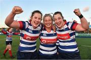 17 December 2022; Blackrock College players, from left, Enya Breen, Emma Hooban and Laura Feely celebrate after their side's victory in the Energia AIL Women's Division Final match between Blackrock College and Railway Union at Energia Park in Dublin. Photo by Seb Daly/Sportsfile