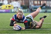 17 December 2022; Anna Doyle of Blackrock College scores her side's fourth try, despite the tackle of Railway Union's Stephanie Carroll, during the Energia AIL Women's Division Final match between Blackrock College and Railway Union at Energia Park in Dublin. Photo by Seb Daly/Sportsfile