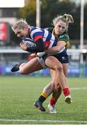 17 December 2022; Anna Doyle of Blackrock College is tackled by Stephanie Carroll of Railway Union on her way to scoring her side's fourth try during the Energia AIL Women's Division Final match between Blackrock College and Railway Union at Energia Park in Dublin. Photo by Seb Daly/Sportsfile