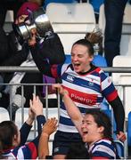 17 December 2022; Blackrock College captain Michelle Claffey lifts the trophy after her side's victory in the Energia AIL Women's Division Final match between Blackrock College and Railway Union at Energia Park in Dublin. Photo by Seb Daly/Sportsfile