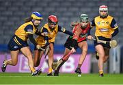 17 December 2022; Niamh Butler of James Stephens in action against Clonduff players, from left, Jenna Boden, Erin Rafferty and Níohmí Murray during the AIB All-Ireland Intermediate Camogie Club Championship Final match between Clonduff of Down and James Stephens of Kilkenny at Croke Park in Dublin. Photo by Piaras Ó Mídheach/Sportsfile