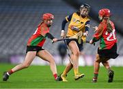 17 December 2022; Cassie Fitzpatrick of Clonduff in action against Anna Doheny, left, and Emily Smith of James Stephens during the AIB All-Ireland Intermediate Camogie Club Championship Final match between Clonduff of Down and James Stephens of Kilkenny at Croke Park in Dublin. Photo by Piaras Ó Mídheach/Sportsfile