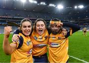 17 December 2022; Clonduff players, from left, Erin McAlinden, Elizabeth Wilson and Ceallagh Byrne celebrate after their side's victory in the AIB All-Ireland Intermediate Camogie Club Championship Final match between Clonduff of Down and James Stephens of Kilkenny at Croke Park in Dublin. Photo by Piaras Ó Mídheach/Sportsfile