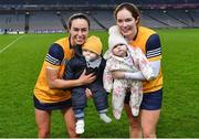 17 December 2022; Clonduff players Paula O'Hagan, left, with her son Charlie, age 11 months, and Sara Louise Graffin with her daughter Cara, age 7 months, after their side's victory in the AIB All-Ireland Intermediate Camogie Club Championship Final match between Clonduff of Down and James Stephens of Kilkenny at Croke Park in Dublin. Photo by Piaras Ó Mídheach/Sportsfile