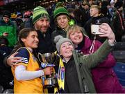 17 December 2022; Clonduff goalkeeper Katie McGilligan celebrates with her uncle's family, from left, her Uncle Thomas McGilligan and his wife Ciara and their children Orlaith, front, and Ruairí after her side's victory in the AIB All-Ireland Intermediate Camogie Club Championship Final match between Clonduff of Down and James Stephens of Kilkenny at Croke Park in Dublin. Photo by Piaras Ó Mídheach/Sportsfile