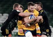 17 December 2022; Stuart McCloskey of Ulster is tackled by Pierre Bourgarit and Romain Sazy of La Rochelle during the Heineken Champions Cup Pool B Round 2 match between Ulster and La Rochelle at Aviva Stadium in Dublin. Photo by John Dickson/Sportsfile