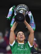 17 December 2022; Sarsfields captain Niamh McGrath lifts the Bill and Agnes Carroll Cup after the AIB All-Ireland Senior Camogie Club Championship Final match between Sarsfields of Galway and Loughgiel Shamrocks of Antrim at Croke Park in Dublin. Photo by Piaras Ó Mídheach/Sportsfile