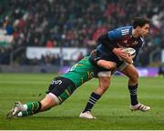 18 December 2022; Joey Carbery of Munster is tackled by Fin Smith of Northampton Saints during the Heineken Champions Cup Pool B Round 2 match between Northampton Saints and Munster at Franklin's Gardens in Northampton, England. Photo by Seb Daly/Sportsfile